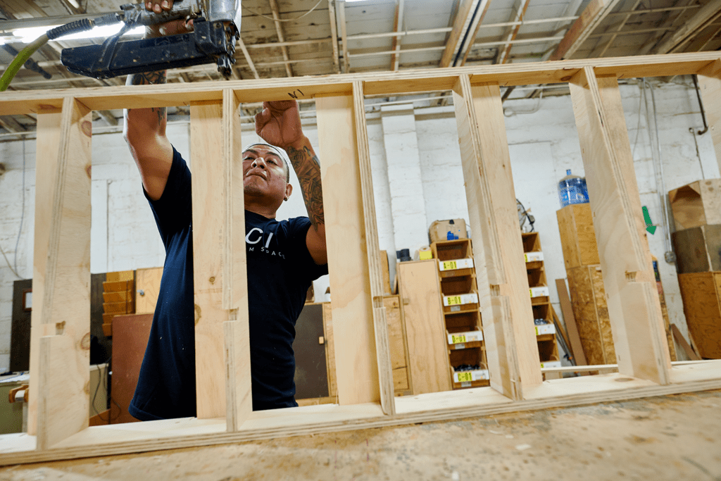 SCI warehouse employee working on a millwork project.
