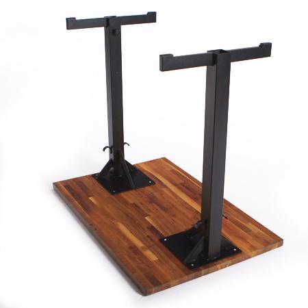 T-Base Rockless Table legs shown connected to a table.
